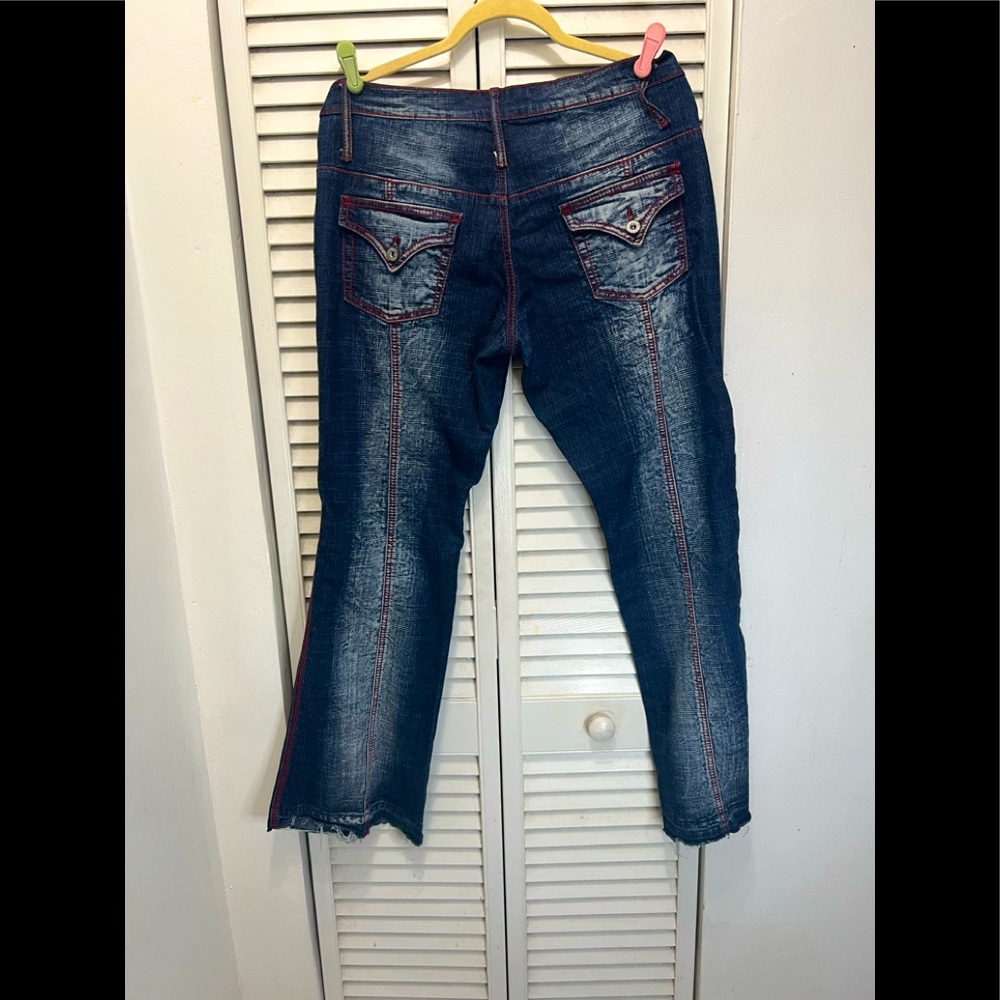 Jeans with red  stitching wide legs  pockets I’m front  and back